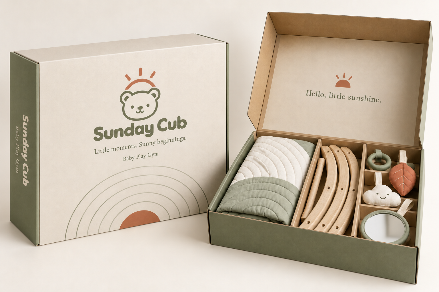 Sunday Cub play gym concept with a quilted mat, wooden arches and hanging toys in olive, cream and terracotta packaging